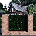 valla decorativa en tubos de hierro color negro