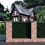 valla decorativa en tubos de hierro color negro